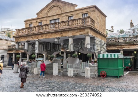 LONDON, UK - OCTOBER 8, 2014 : Floating building illusion by artist Alex Chinneck at Covent Garden in central London named \