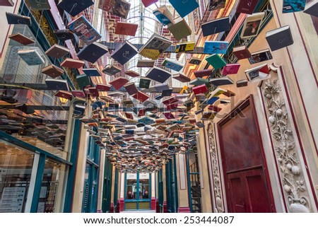 LONDON, UK - OCTOBER 11, 2014 : Ceiling of floating books in the  Victorian roofed Leadenhall Market in the City of London. A historic and popular tourist attraction.