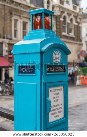 LONDON, UK - OCTOBER 11, 2014 : Vintage blue police phone post in central London outside of Liverpool Street Railway Station. These boxes were introduced in 1891 for police and public use.