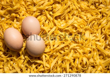 Home made fresh egg pasta background: italian fettuccine (or tagliatelle)