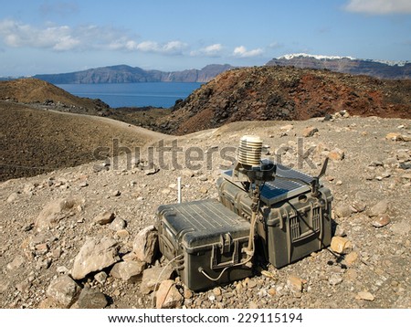 Device to measure volcanic activity with Fira in background, Santorini, Greece.