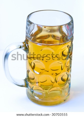 Light beer in a big beer glass without foam isolated on a white background