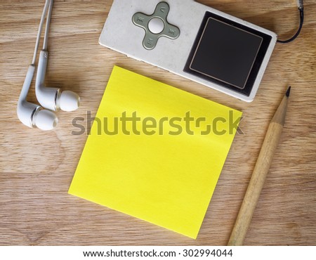 Note paper on a wooden desk. Vintage tone