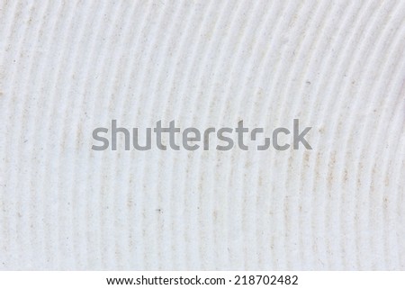 texture of old and dirty sole of a white slipper, background.