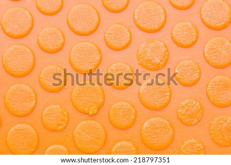 texture of old and dirty sole of a orange slipper, background.