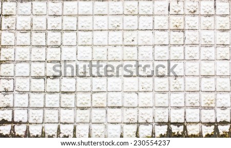 grungy white mosaic tiles flower texture with white filling.