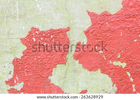 grunge wall with red cracked color caused by moisture and temperature