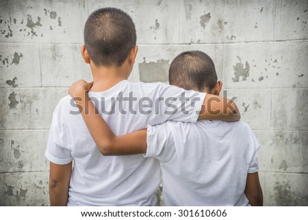Two brothers hugging