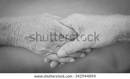 Holding hands, old hands