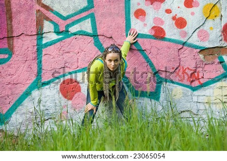 beauty girl on a graffiti wall background