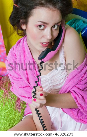 beauty girl pink phone call on color background