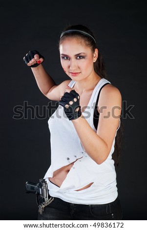 stock photo white girl fighter with long black hair and in black gloves