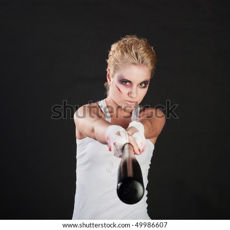 stock photo white girl fighter with baseball bat on black background