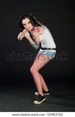 beauty girl with knuckleduster and with body art on her hand