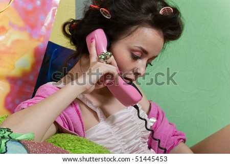 beauty girl pink phone call on color wall background