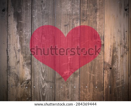 Red Heart on Wood wall background with black vignette