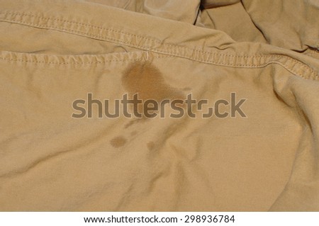 short brown pant with water wet focus on wet area
