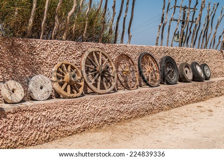 The evolution of the wheel starting from a stone wheel and ending with a steel-belted radial tire.