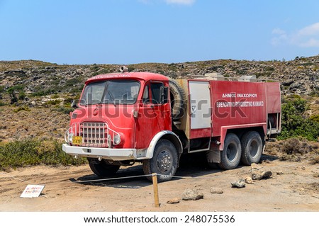 ELAFONISI, GREECE - AUGUST 17: Old  red fire truck at Elafonisi on August 17, 2013 in Elafonisi, Crete island, Greece