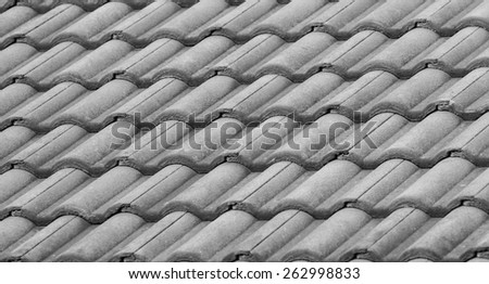 old tiles roof for backgrounds with black and white filter