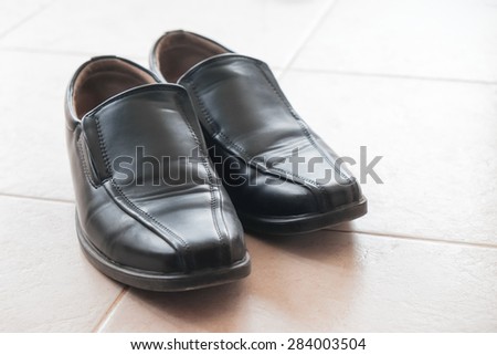 black man shoes on the tiles