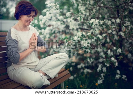 meditating woman in yoga pose