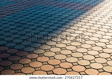 shade and light. brick floor with sunlight in morning. separate dark zone and light zone