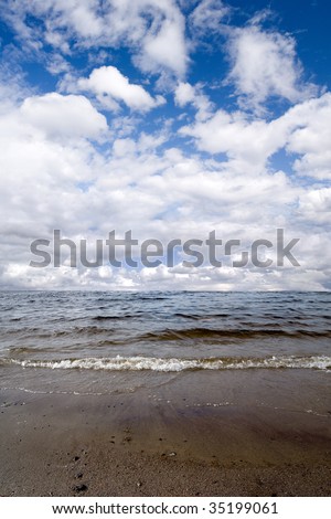 Kola Bay on the background of blue sky with cloud