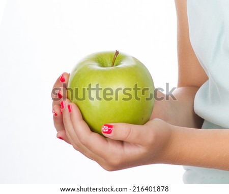 Apple in hands Granny Smith apple in small girls\' hands
