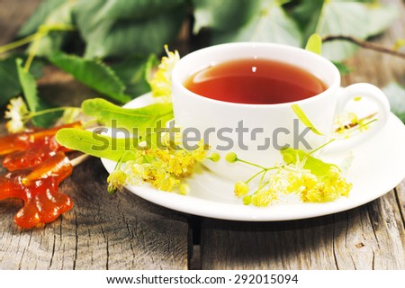 Cup of tea with linden flowers. Selective focus