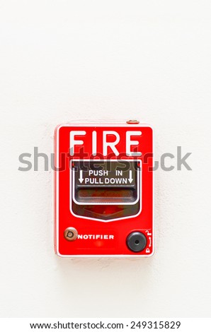 fire break glass alarm switch on white wall