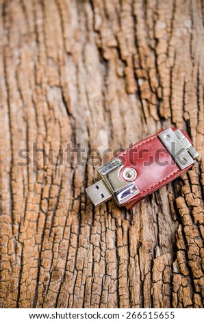 usb flash drive on wooden texture background,usb handy drive