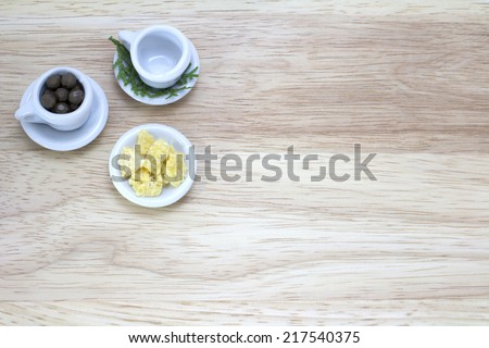 picture of cups and snack with wood background
