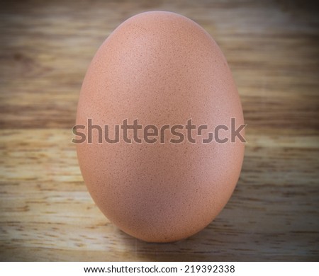 A Chicken Egg on the wood