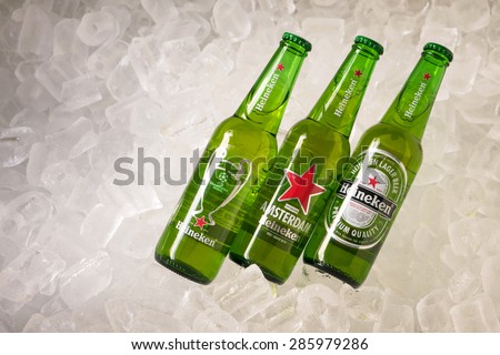 Chiang Rai - Thailand - March 27, 2015 Heineken beer on ice. Heineken is a brand of beer brewed in Holland. It is a popular and favorite of Thailand. Sold 3 Design logo on the bottles to choose from.