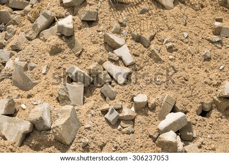 Debris, concrete cube and sand scrap from construction