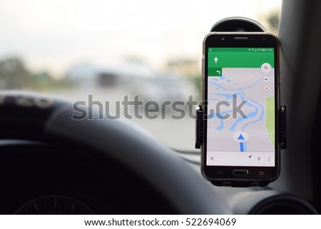 mobile phone with map gps navigation in car.
