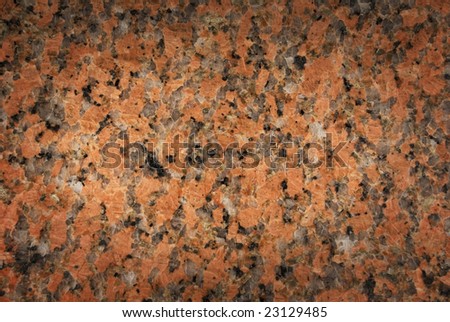 Pink and black granite texture fading to dark edges