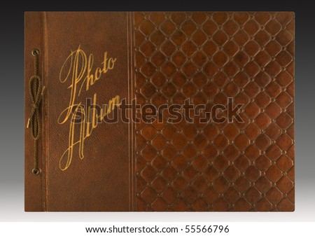 Embossed leather cover of a 1940s-era photo album with gold imprinting. includes clipping path.