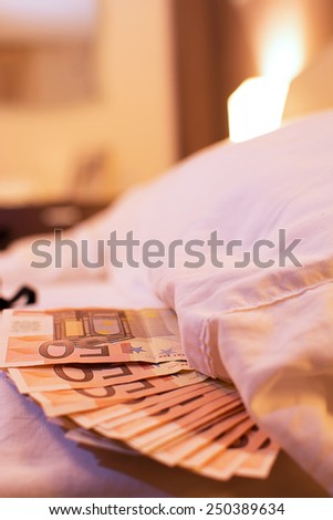 Underware, bed and money to symbolize the cost of sex.