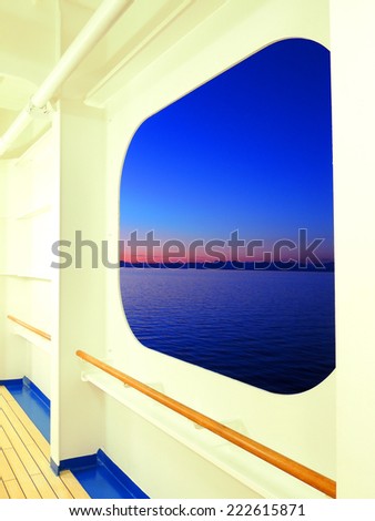 british columbia sunset as seen from a  promenade deck window on a princess cruise ship