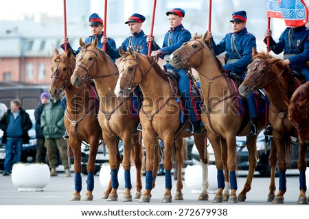 MOSCOW - APRIL 24, 2015: cavalry of Russian Cossacks on Don horses ready for hike in a way to Berlin - reconstruction of scene in I World War.