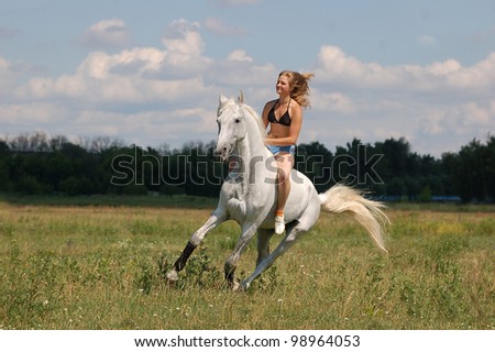 girl on white horse runs free