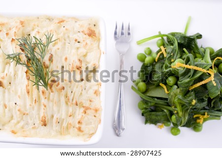 Gourmet fish pie with pea and spinach salad.