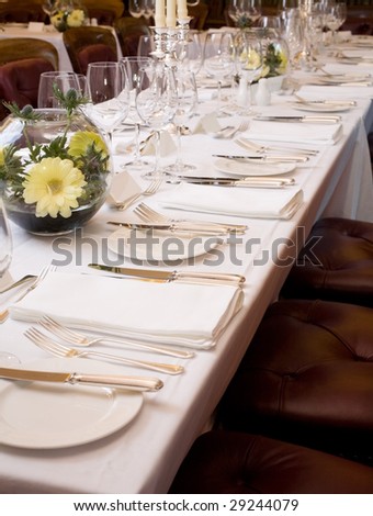 Table set for fine dining for a large group.