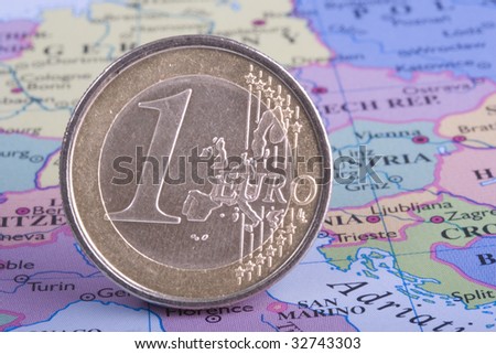 Old, battered Euro Coin on European Map