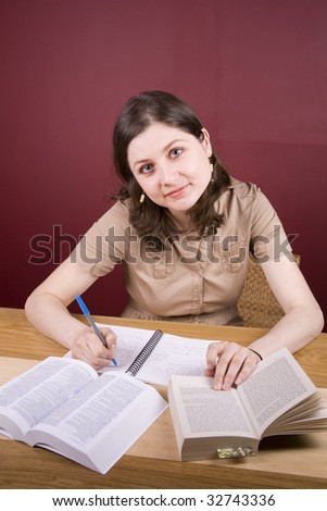 Pretty, young woman studying in a home environment.