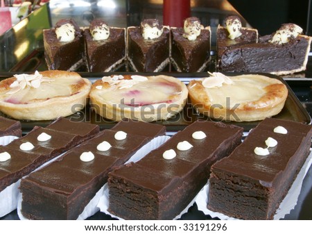 Please see all my other food photos as well. Line up of chocolate slices, tarts and cakes.