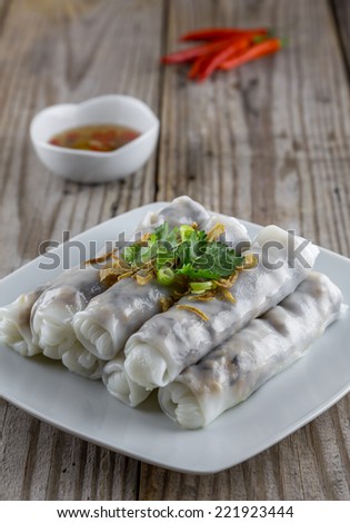 Vietnamese styled steamed rice noodle rolls with fish sauce and red pepper.
