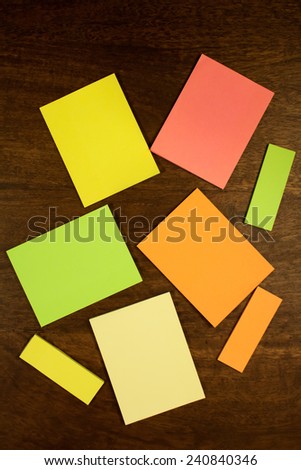 Blank post its lying on a office table. Top view.